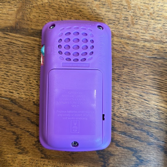 Multi-pack take along toys. Includes remote, phone and misc. book type toy. - Picture 9 of 11